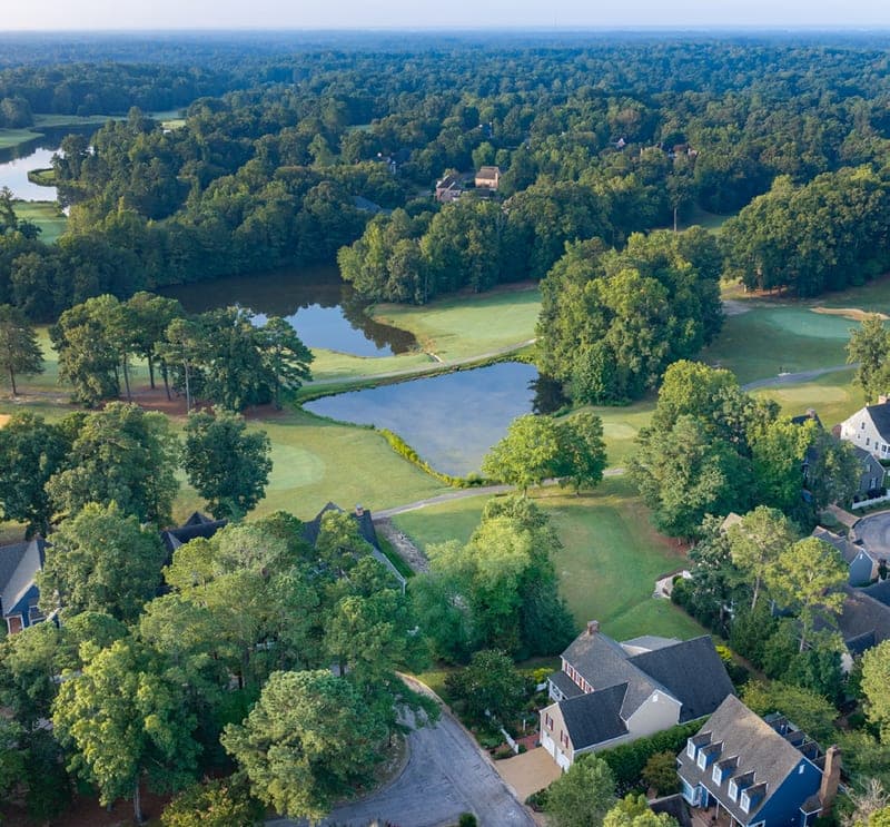 Aerial view over Ford's Colony fairways and lakes near 145 Hollinwell